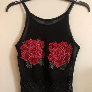 Black sheer and lace top with red flowers